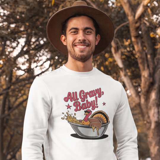 'All Gravy, Baby!' t-shirt from Trippy Outfitters featuring a relaxed turkey lounging in a gravy boat like a luxury hot tub, complete with sunglasses and gravy splashes for extra flair. This playful, conversation-starting design brings laid-back vibes, perfect for Thanksgiving or any time you want to keep it fun and saucy. Soft and comfortable, this tee is sure to make everyone smile.