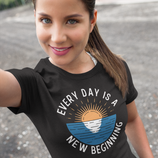 "Every Day is a New Beginning" Tee by Trippy Outfitters. This uplifting design features a serene sunrise over a calm ocean, symbolizing hope, renewal, and endless possibilities. A reminder to embrace each day with a fresh perspective and new opportunities.