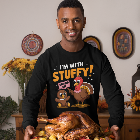 'I’m With Stuffy!' t-shirt from Trippy Outfitters featuring a cute turkey pointing to its stuffed animal friend, with a sparkling 'Stuffed BFF' sign. This whimsical, clever design is perfect for turkey lovers and anyone who enjoys a good laugh. Made from soft, comfortable fabric, this tee is ideal for casual outings or festive gatherings, showcasing a quirky sense of humor and love for all things cuddly.