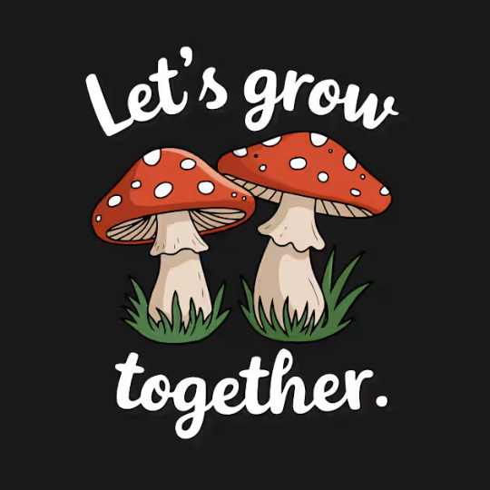 "Let's Grow Together" Tee by Trippy Outfitters. This heartwarming design features two mushrooms growing side by side, symbolizing growth, connection, and togetherness. Perfect for friends, couples, or anyone who values shared growth.